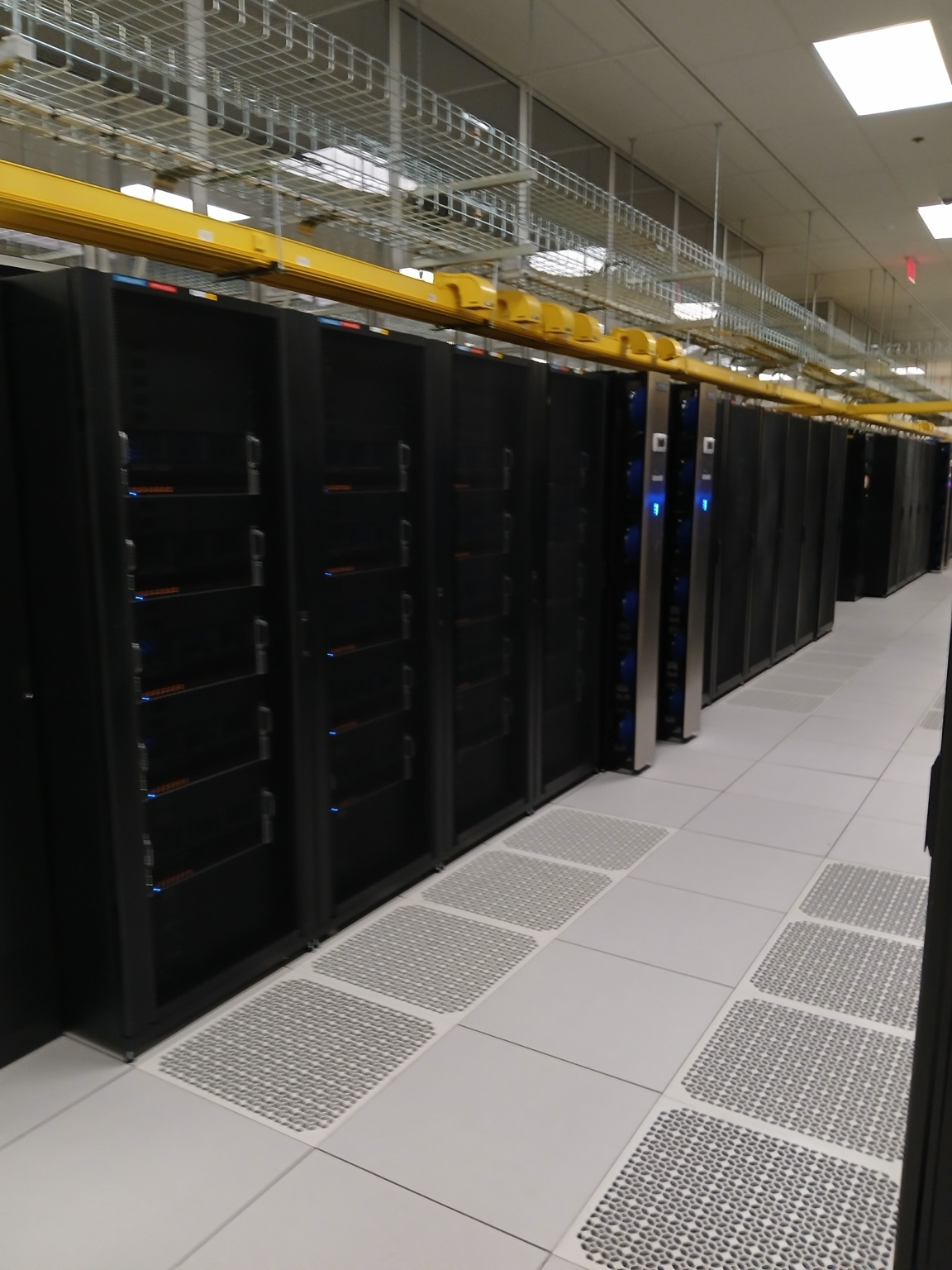 Data center server cabinets and overhead cable pathways