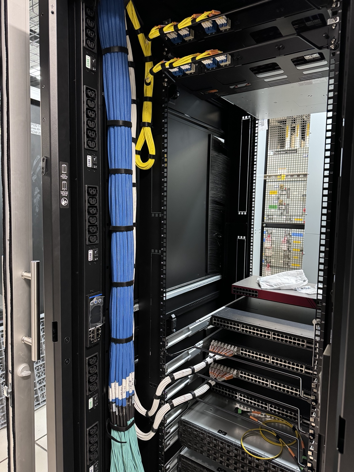 Organized network and fiber cabling inside an equipment rack
